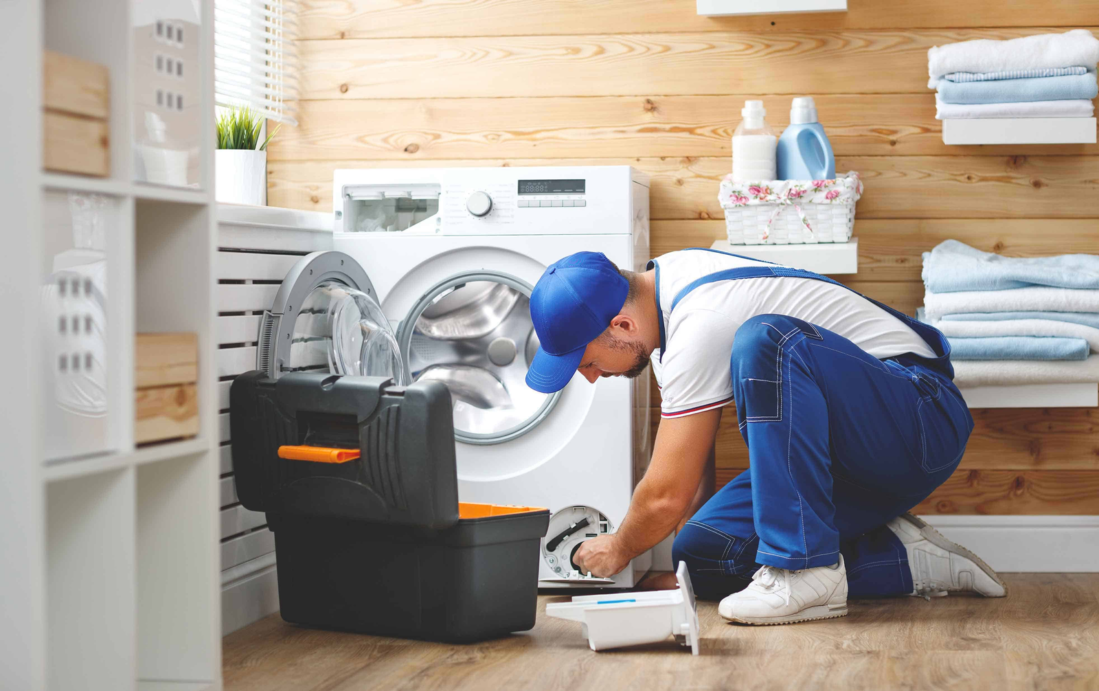 Sri Lakshmi Home Care — technician repairing a washing machine